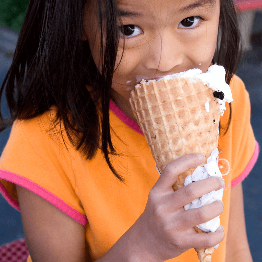 asian child eating ice cream cone