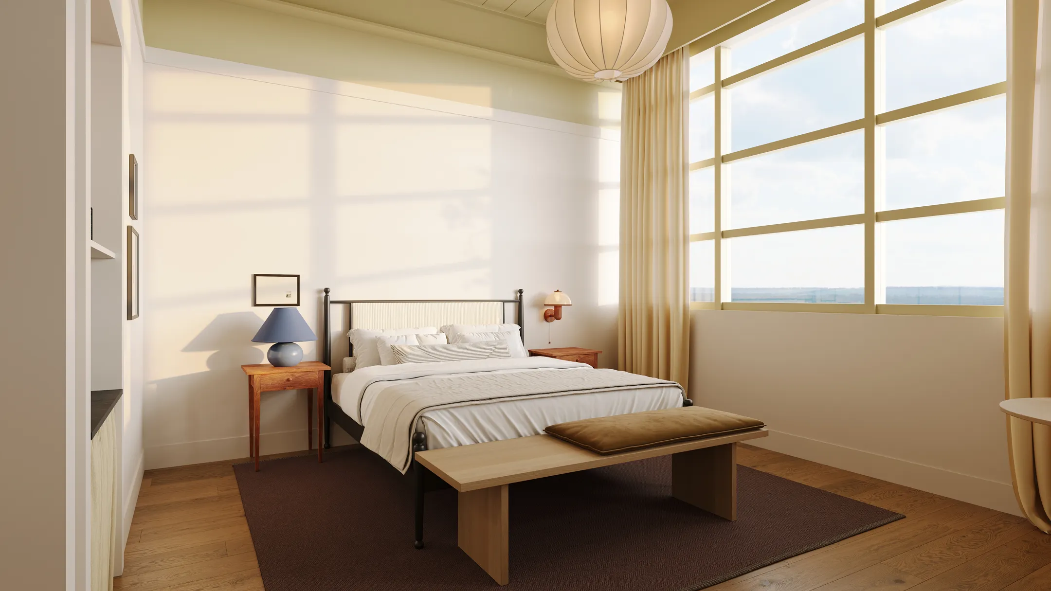 Bright bedroom with large window, metal-framed bed, wooden bench, bedside tables, and warm-toned decor.