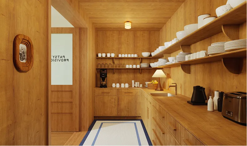 Cozy wooden kitchen with open shelves displaying white dishes, a coffee machine, a table lamp, and kitchen appliances on the countertops.