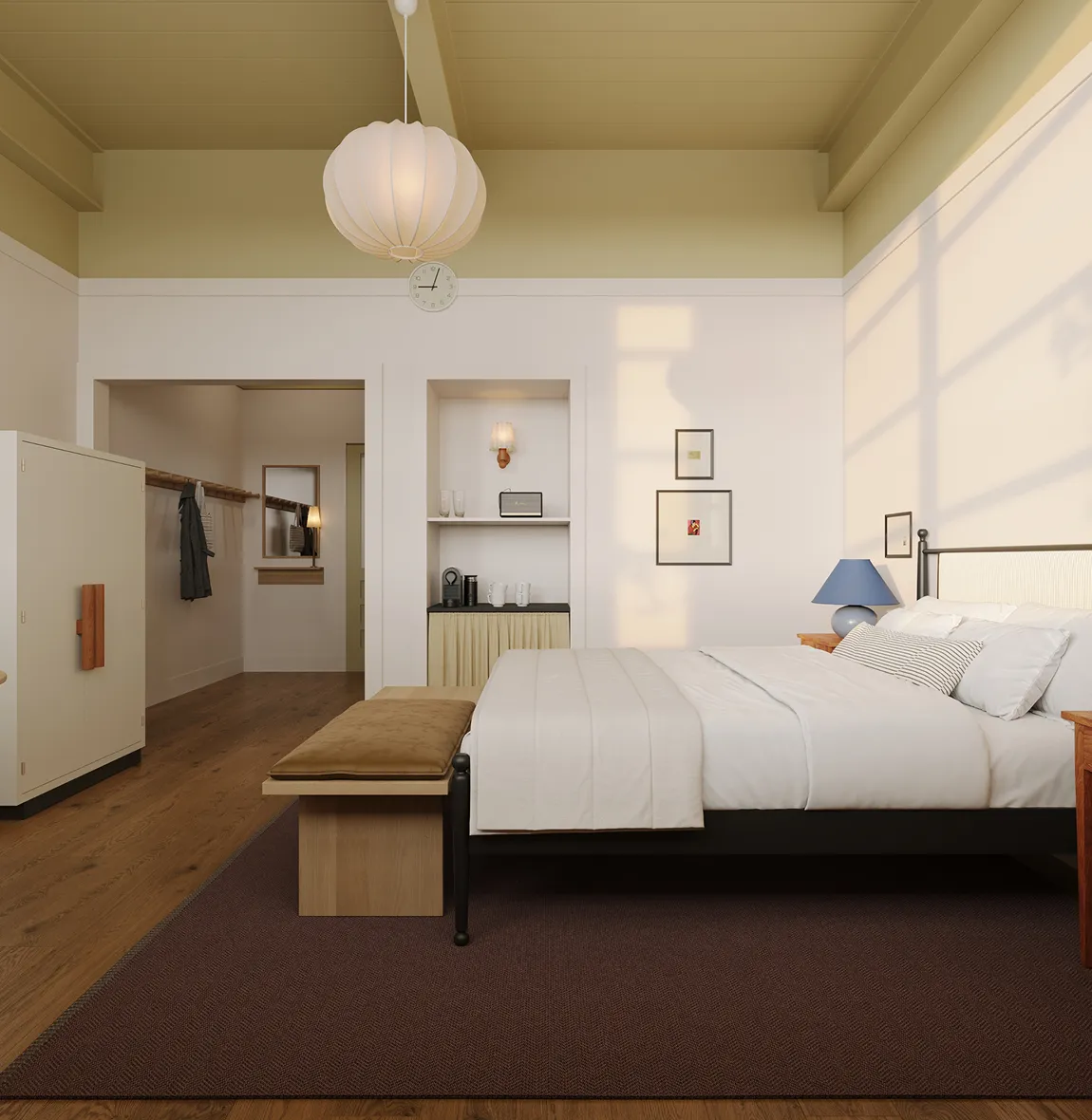 Minimalist bedroom with a bed, cushioned bench, white walls, pendant light, and wooden floor.