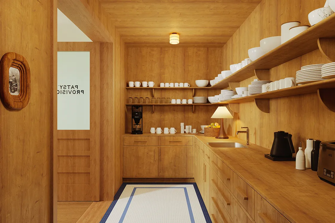 Cozy wooden kitchen with shelves of white dishes, a coffee maker, a lamp, and a basket of lemons on the counter.