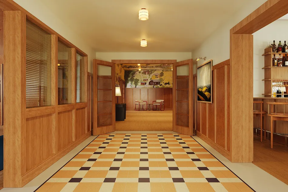 Wood-paneled hallway with checkered floor leading to open double doors and a bar area with bottles and stools to the right.