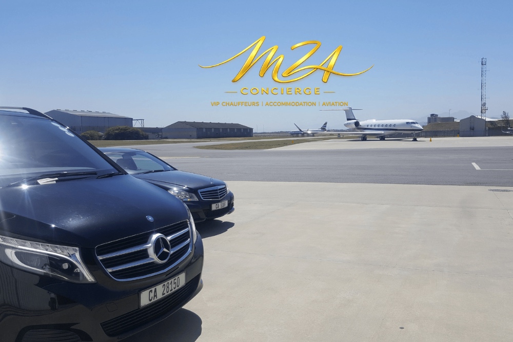 Luxury vehicle in front of a private jet