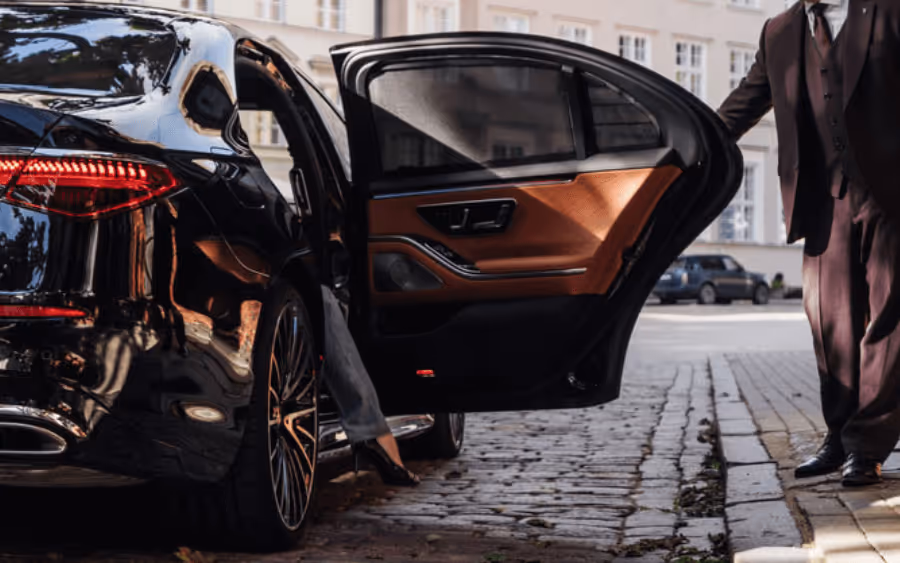 Fleet of luxury supercars in front of hotel