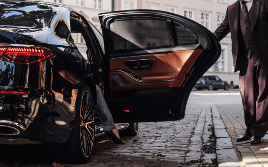 Fleet of luxury supercars in front of hotel