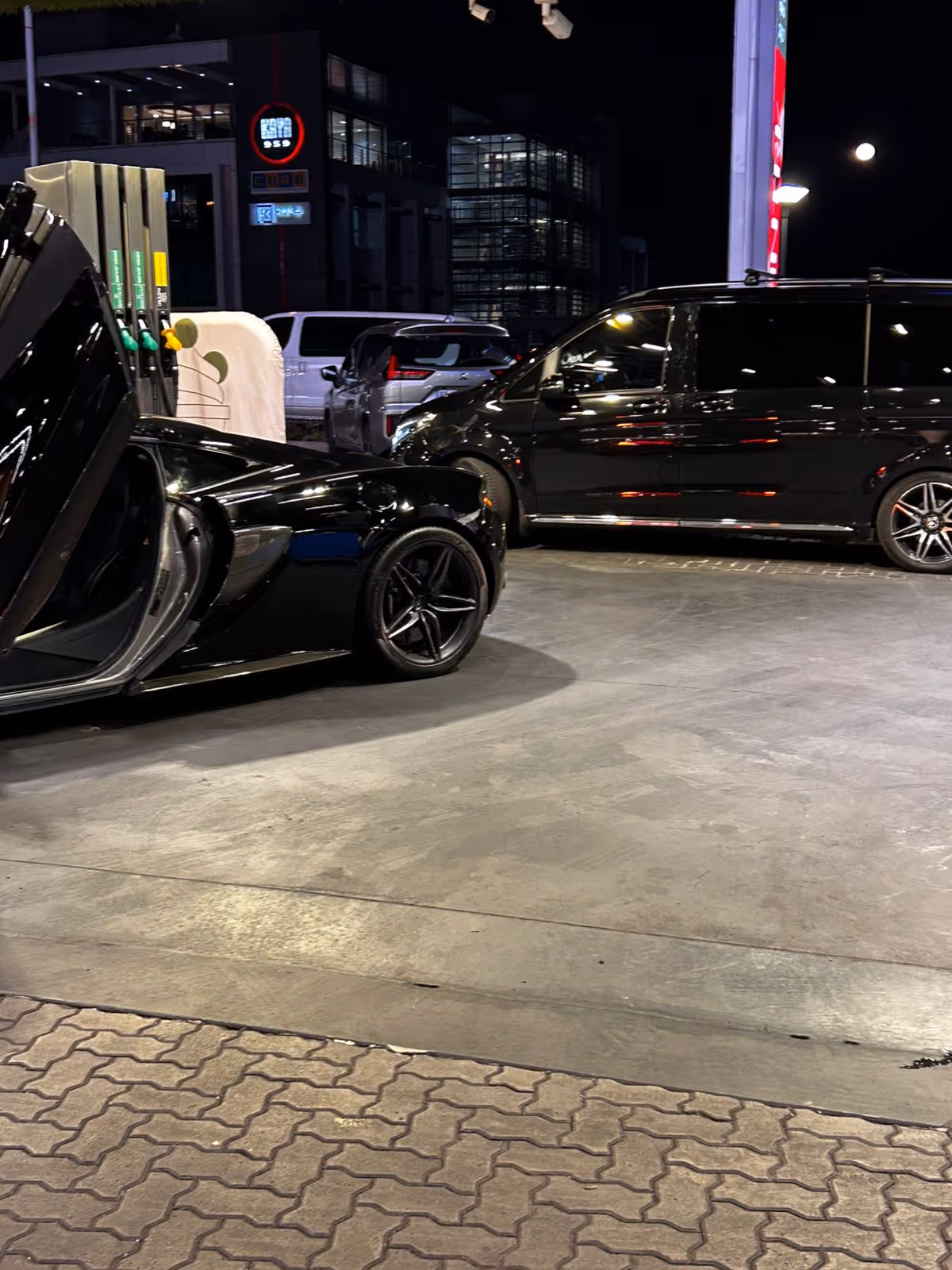 Luxury vehicle in front of a private jet