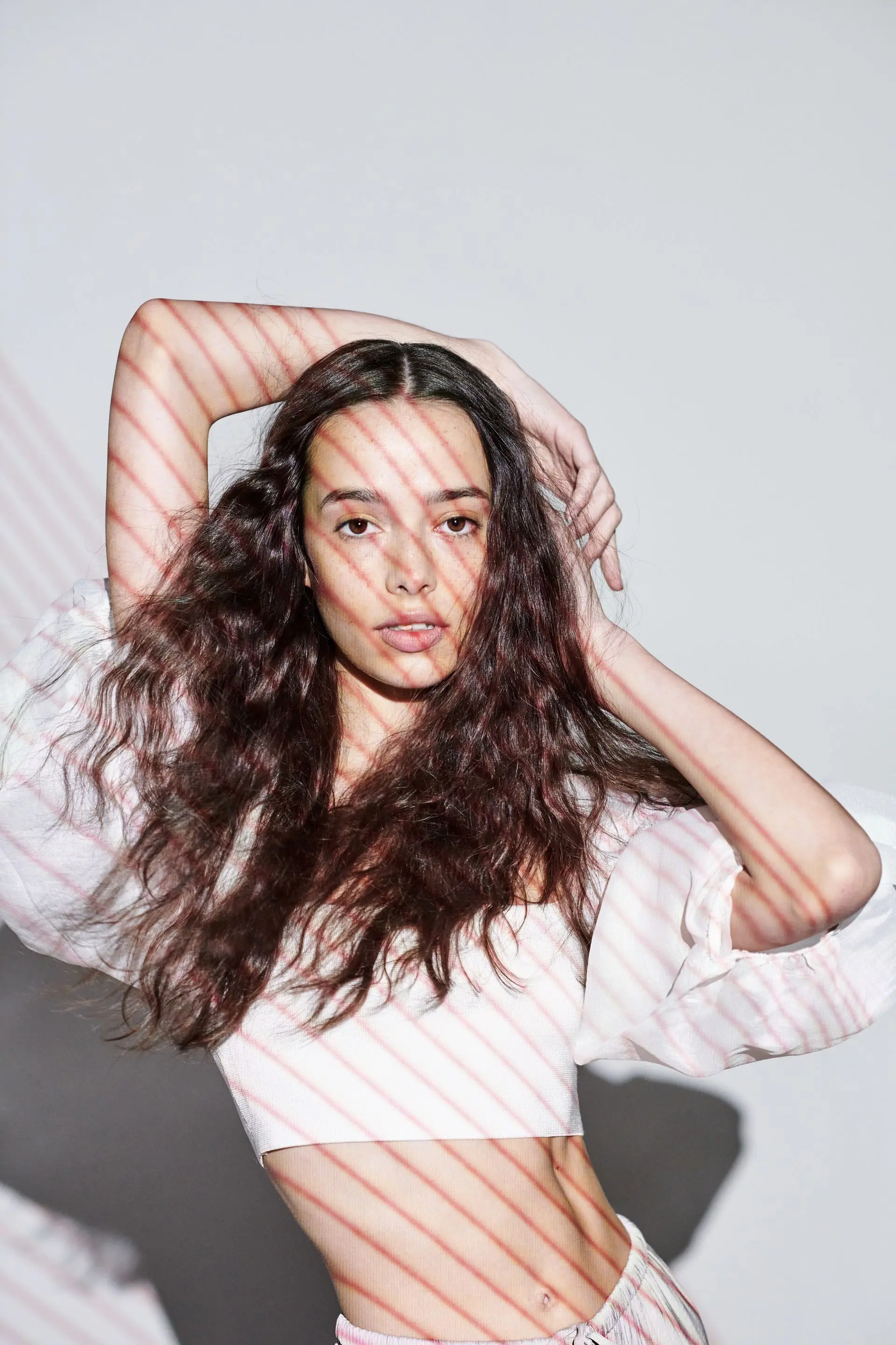Model in a white dress with ruffles