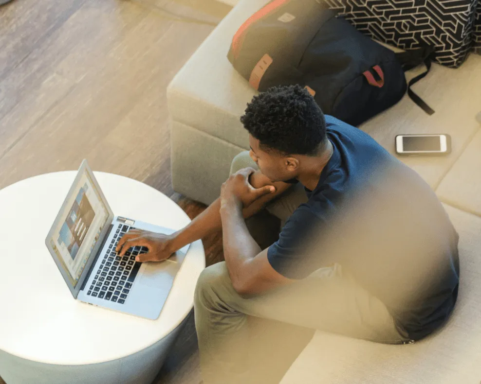 A person working on a laptop in an office