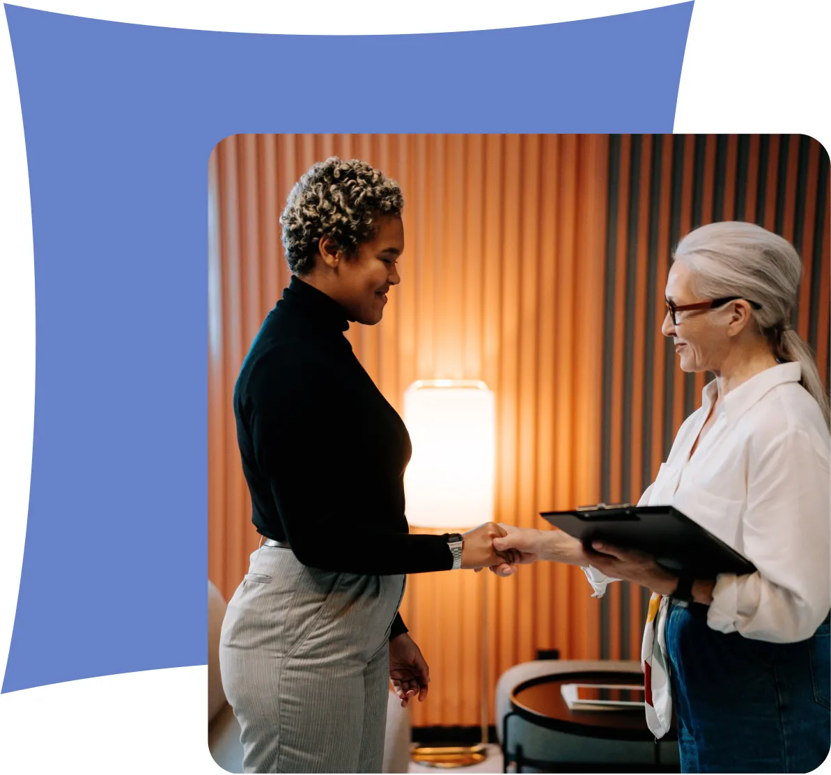 A patient holding her cheek in discomfort, speaking with a concerned doctor in a medical office.