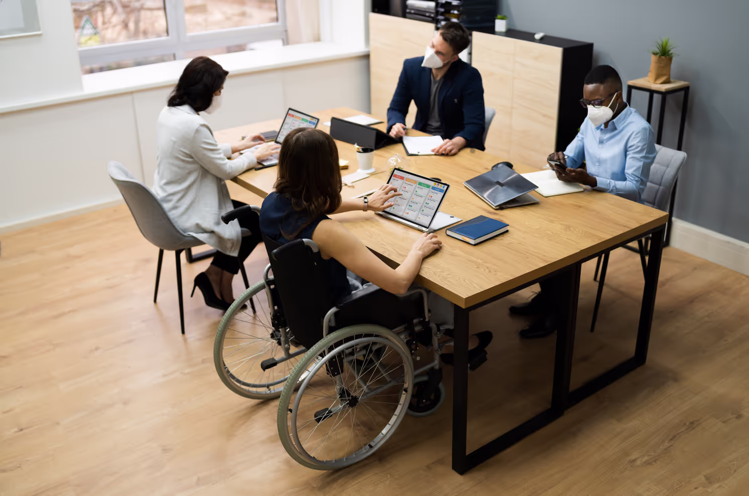 Co-workers sitting at a desk.