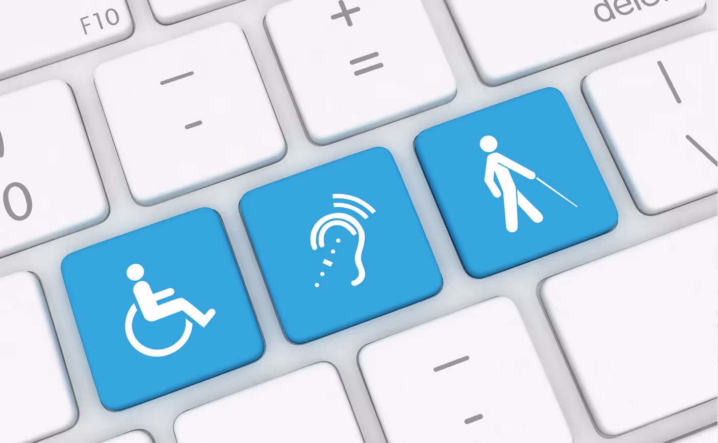 Close up of a computer keyboard featuring keys representing mobility, hearing, and vision.