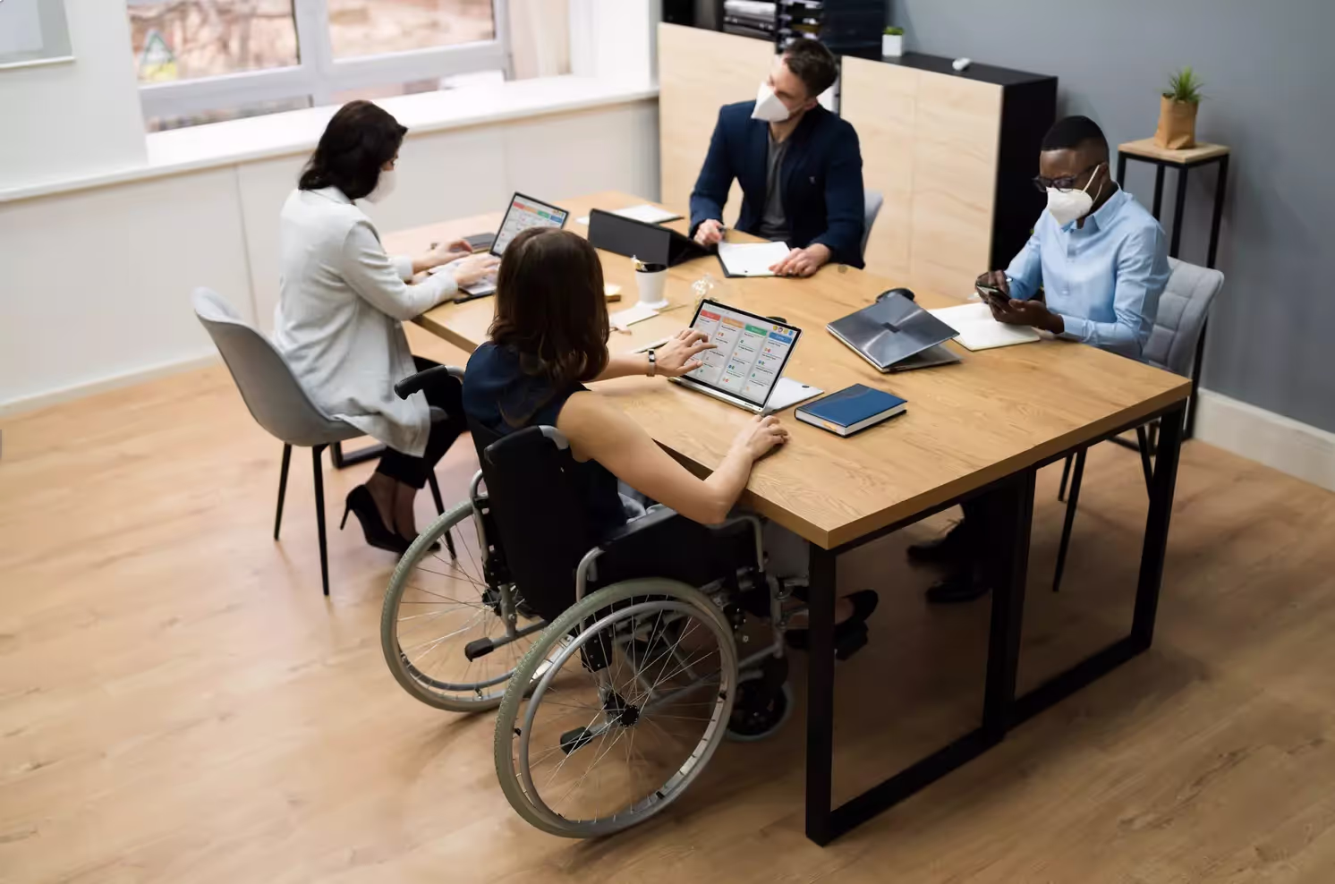 Co-workers sitting at a desk.