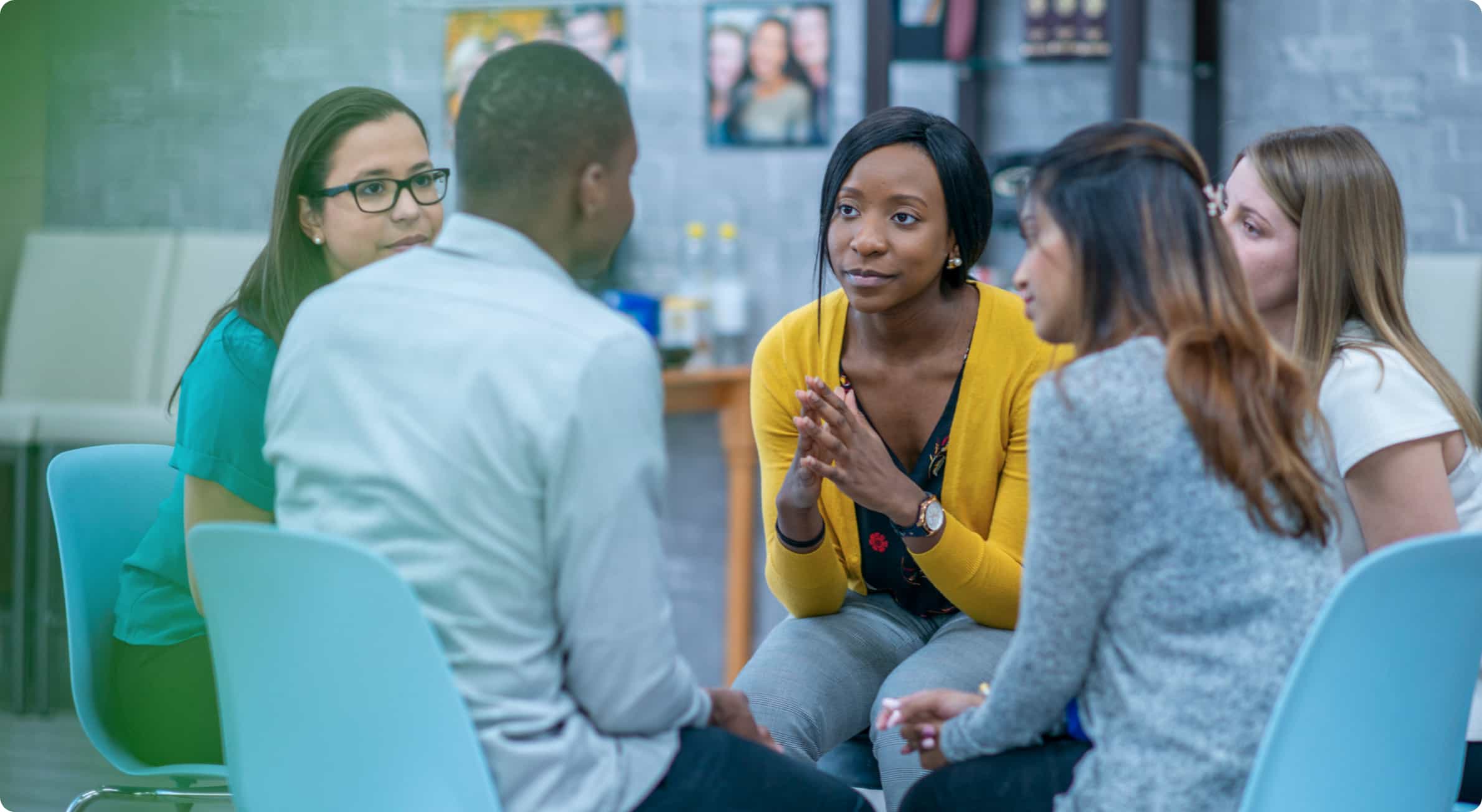 A group of coworkers having a conversation.