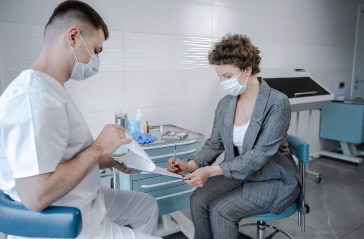 Photo of a doctor and patient.