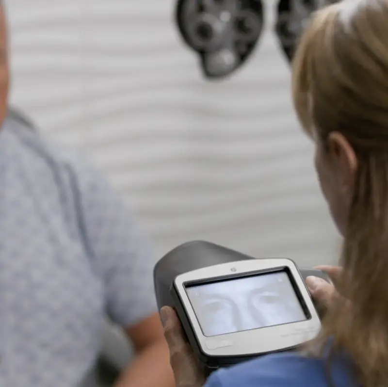 Still image from https://3dassets.hillrom.com/content2/FLC-Vision-SVS_Calabrese-27.mp4 showing use of a Welch Allyn Spot Vision screener