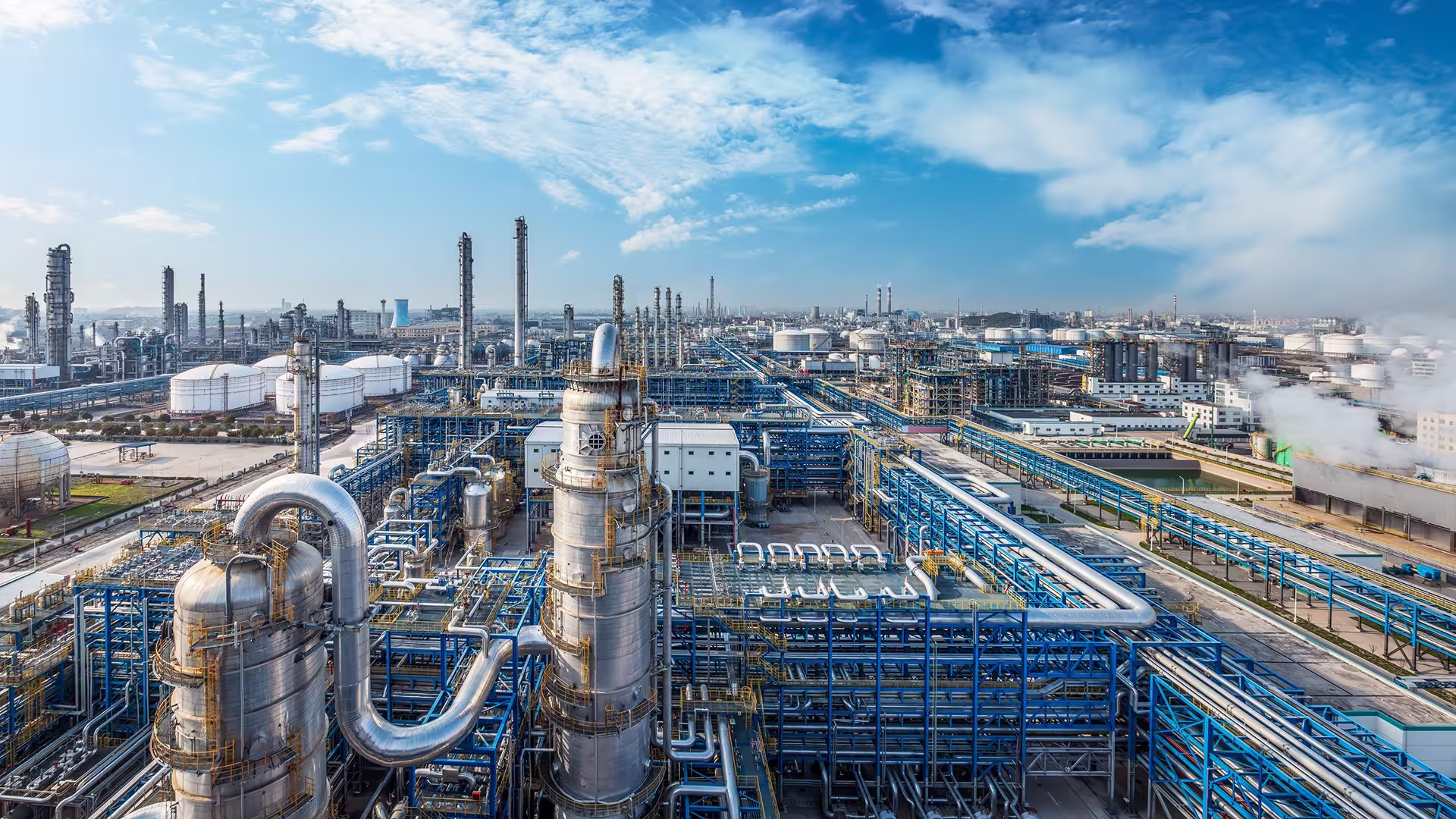 Aerial view of an industrial refinery — environmental monitoring of oil sites and SEVESO compliance
