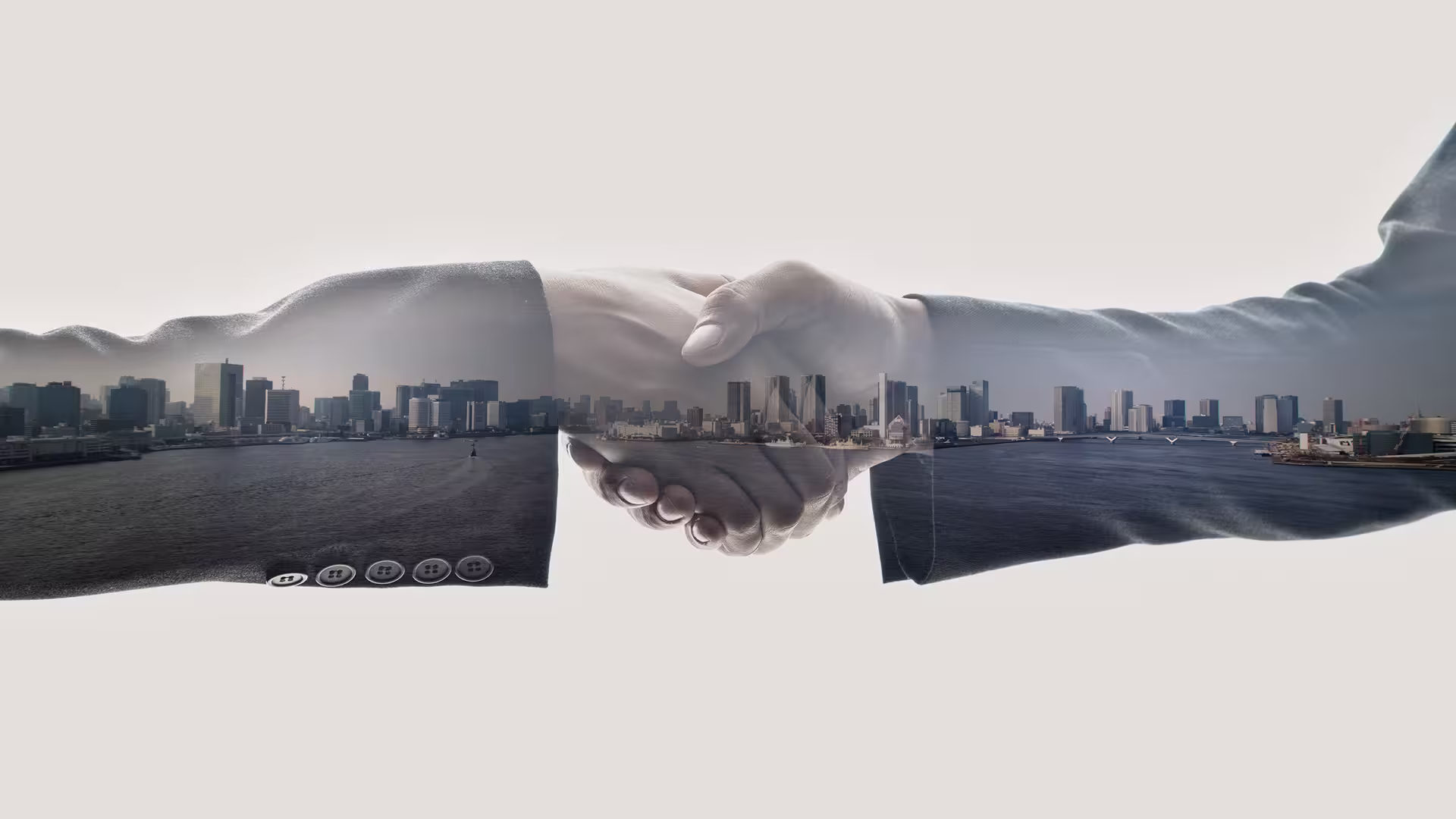 Handshake in front of a city — partnership, institutional collaboration and development of sustainable urban projects