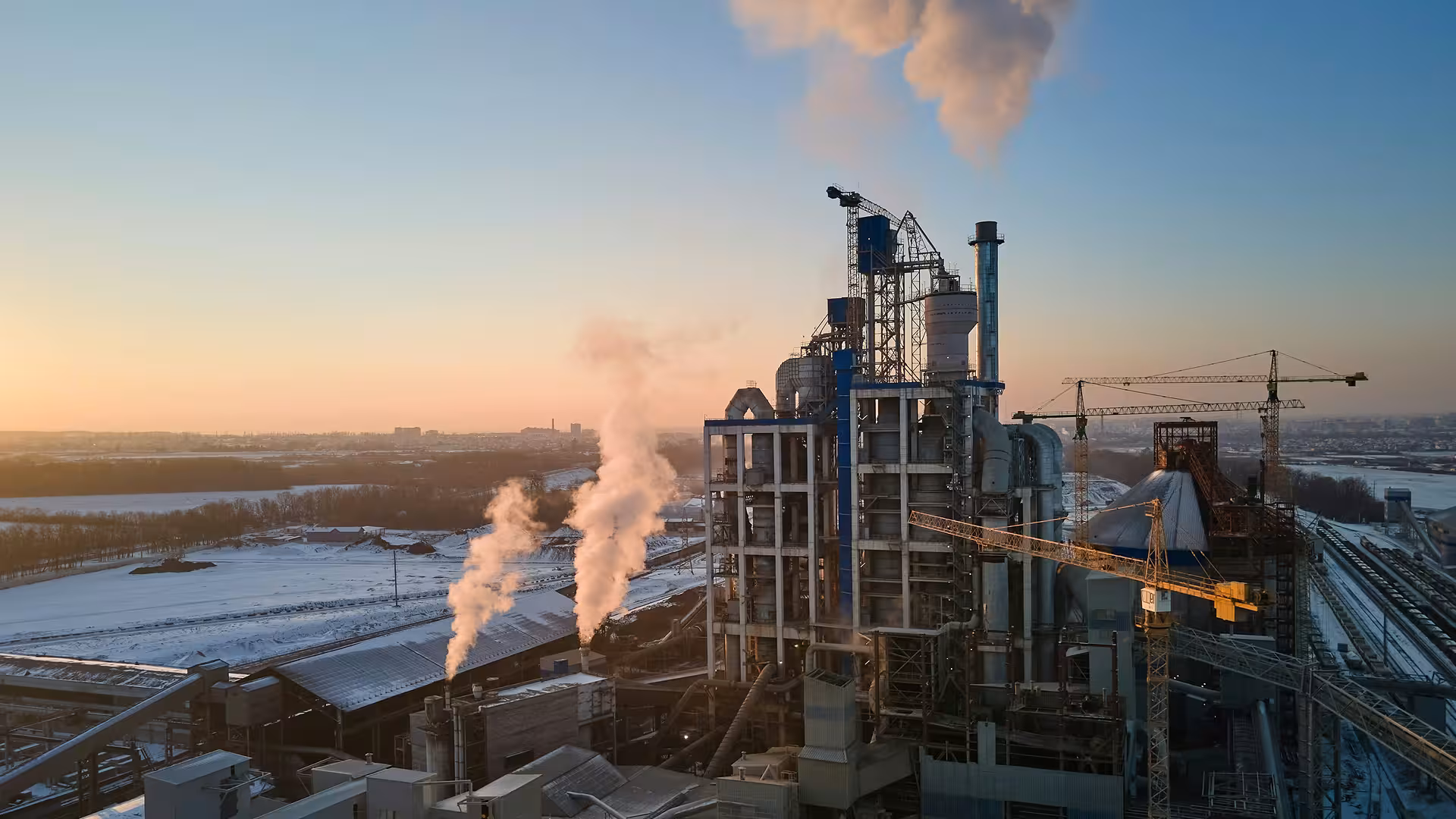 Industrial factory with smoking chimneys in the middle of winter, illustration for Equipment & tools