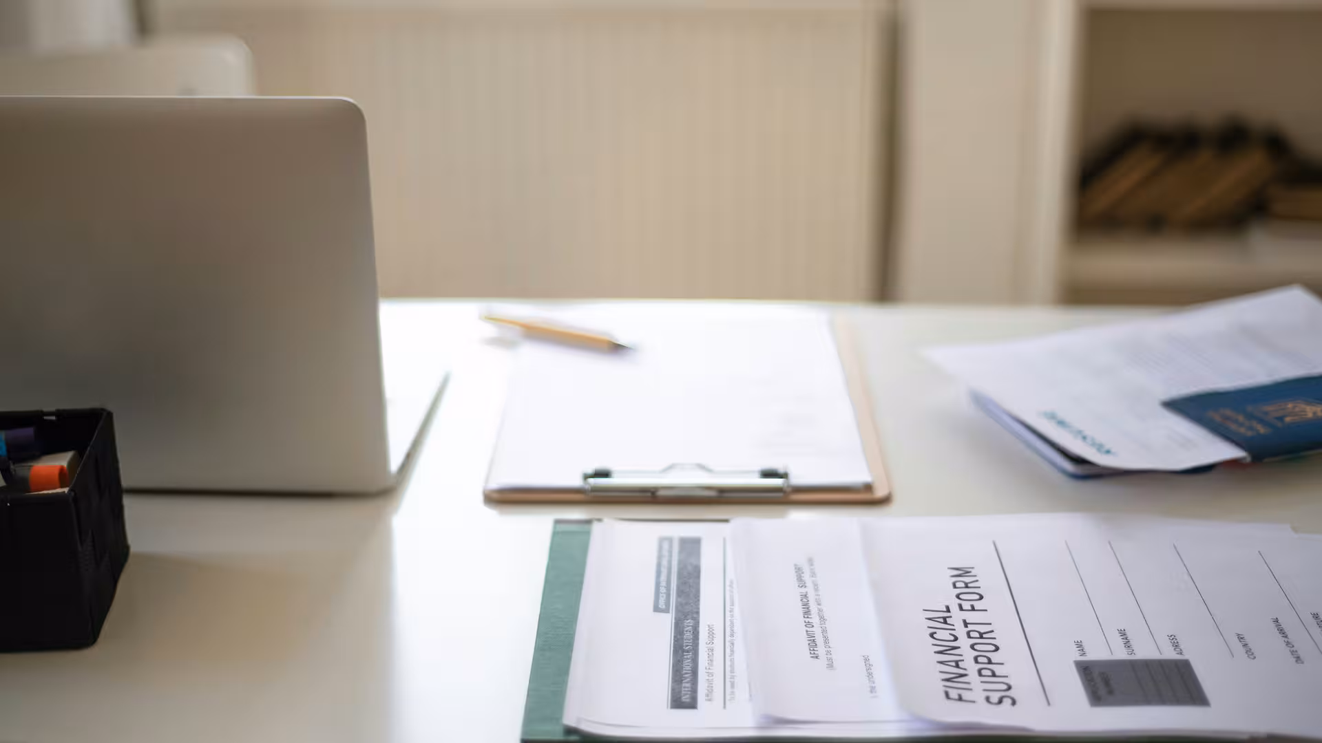 Office with laptop, forms and administrative documents