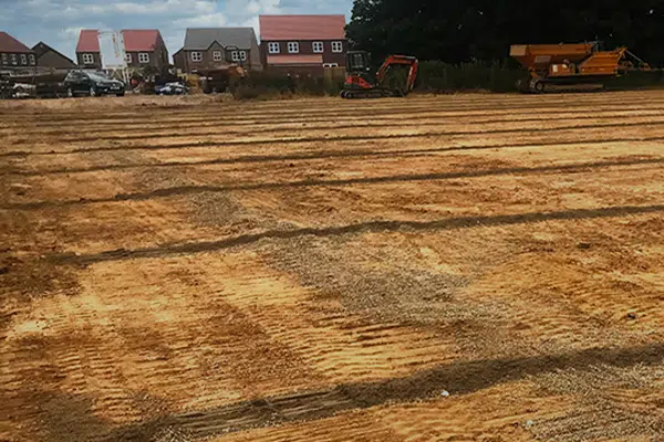 An image showing a well dug ditch preparing for drain pipes