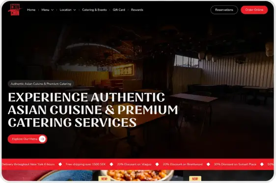 Restaurant website homepage featuring dimly lit dining area and text promoting authentic Asian cuisine and premium catering services.