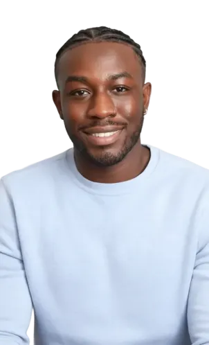 Smiling young Black man with braided hair wearing a light blue sweatshirt.