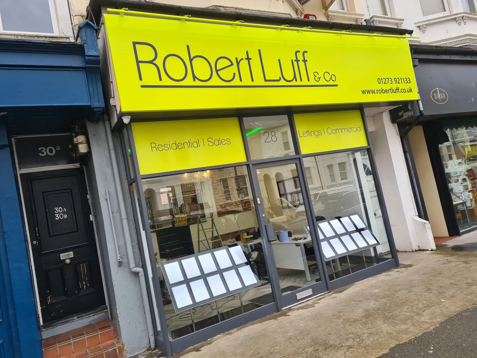 Robert Luff estate agent shop sign