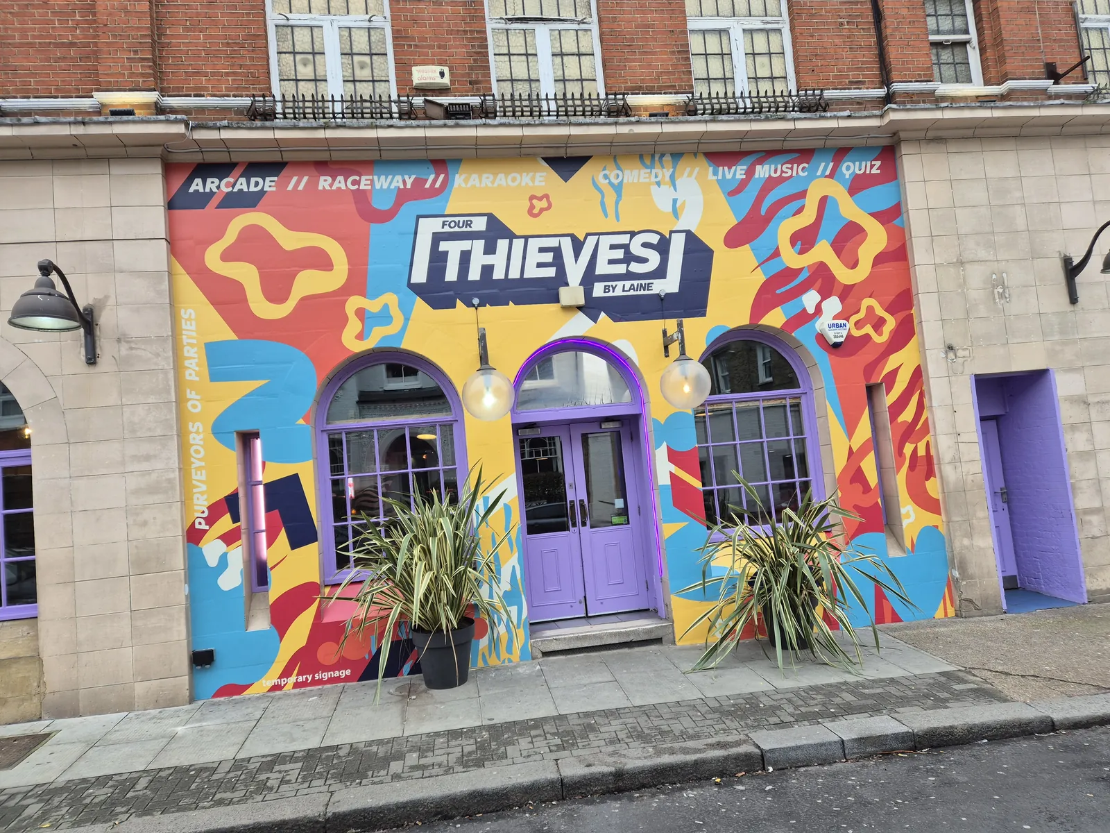 Colourful printed mural on the Thieves pub frontage
