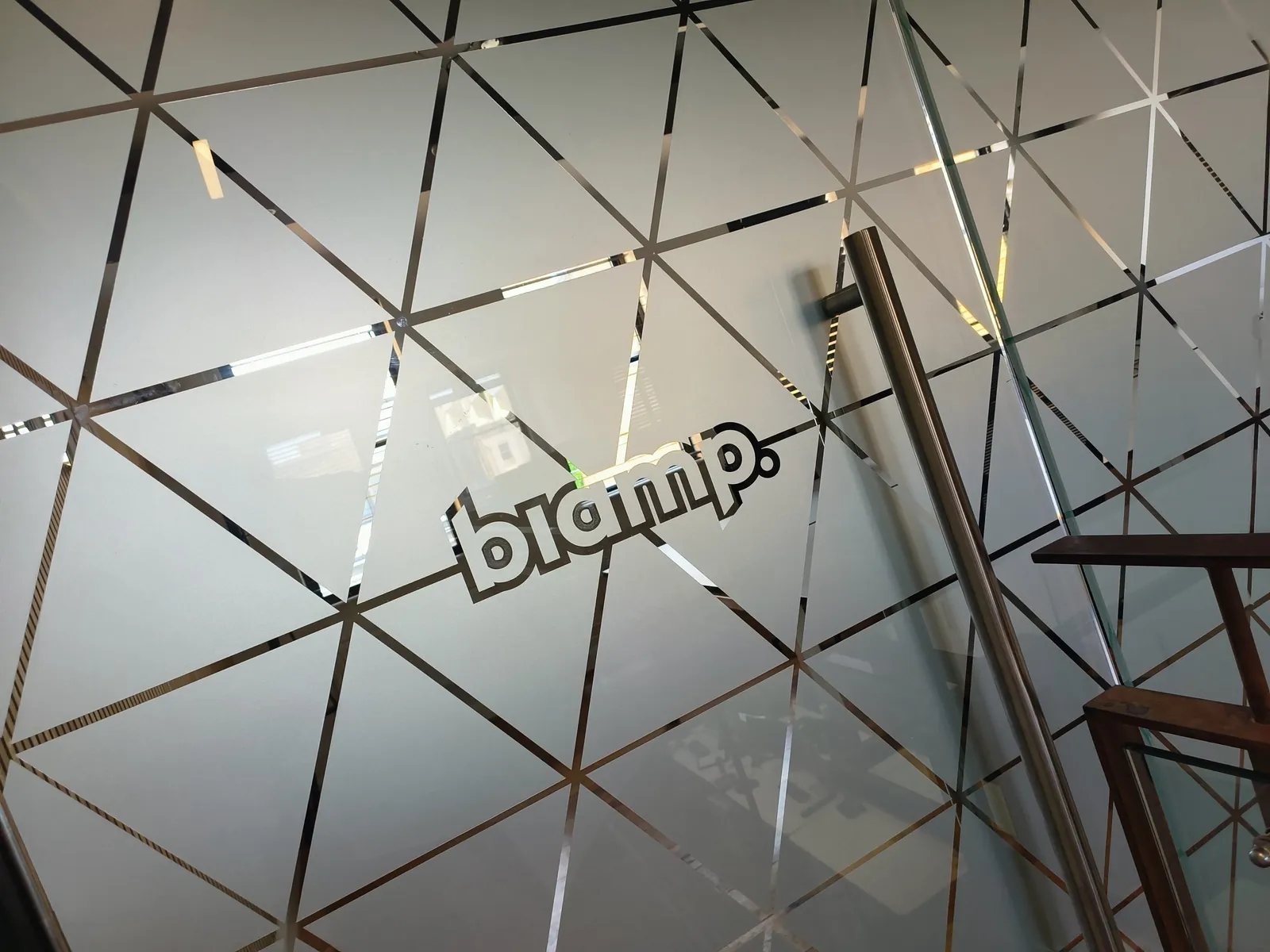 Biamp frosted glass manifestation with geometric pattern