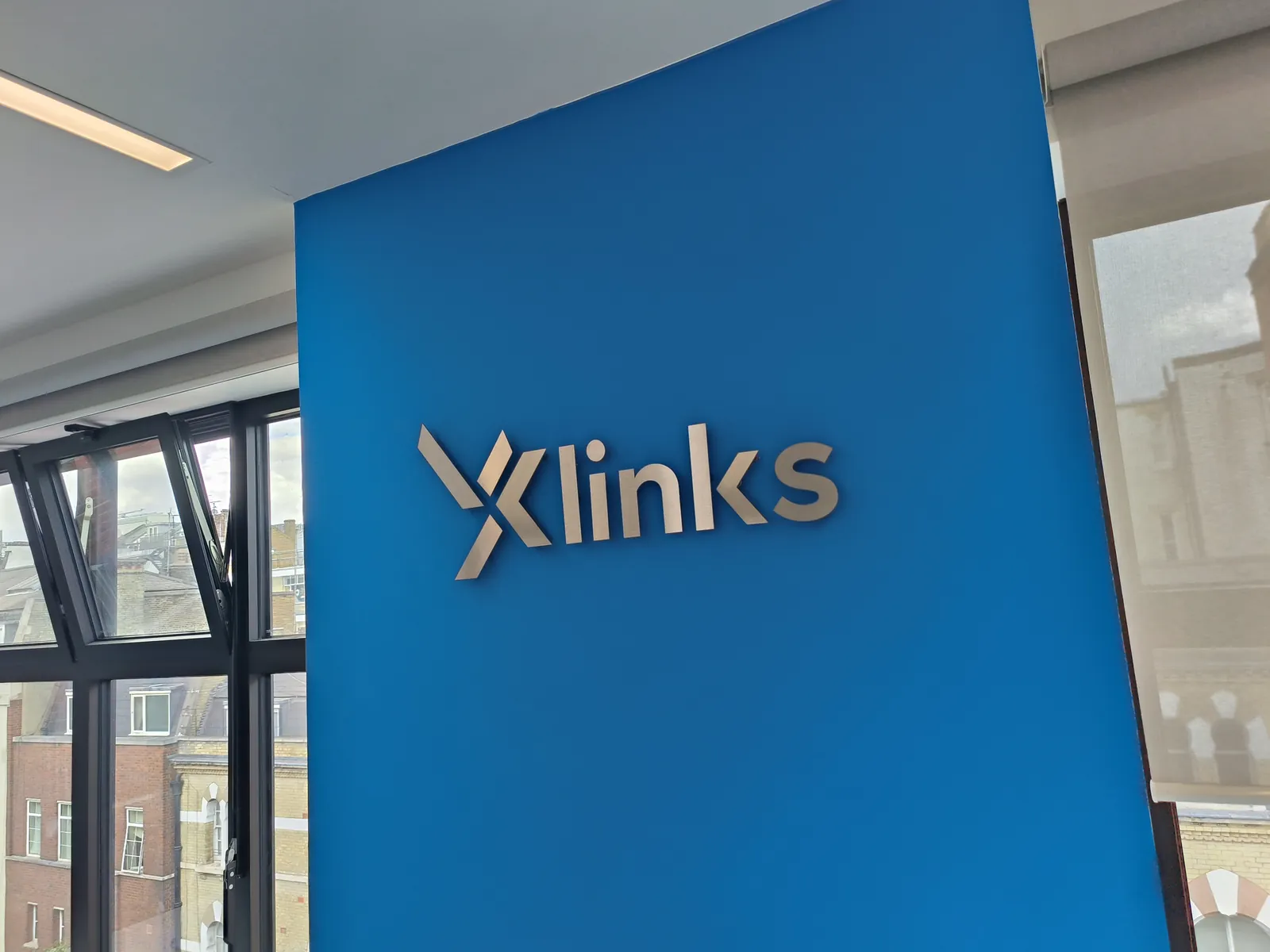 Xlinks reception sign on a blue panel
