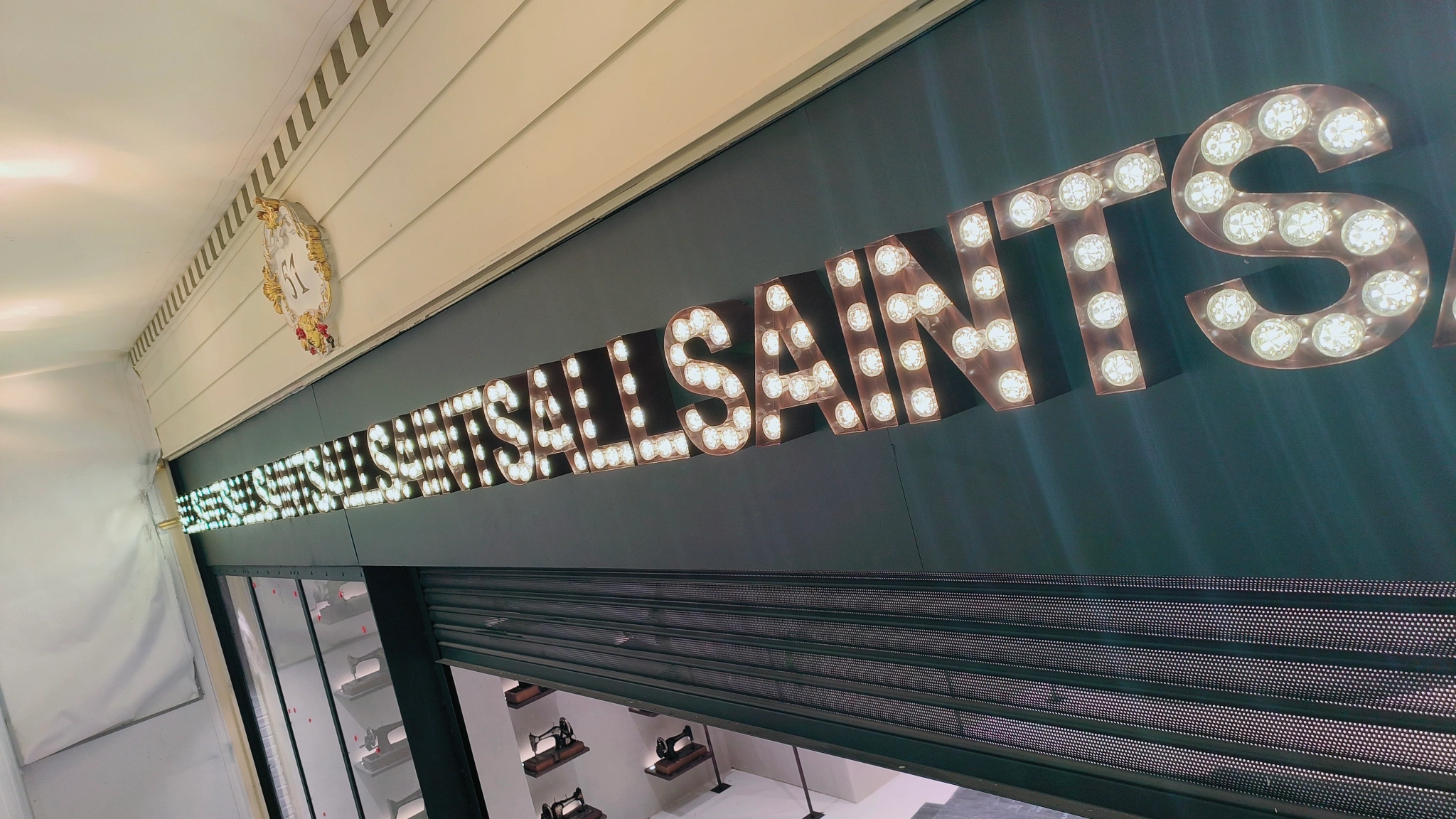 AllSaints illuminated bulb lettering