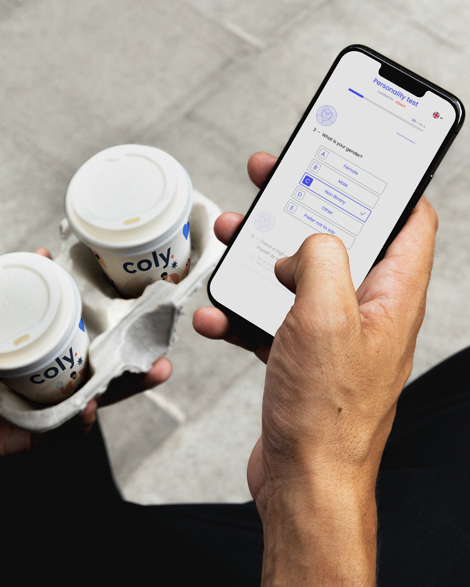 Person holding a smartphone displaying a personality test with gender options, while carrying two takeaway coffee cups labeled 'coly'.