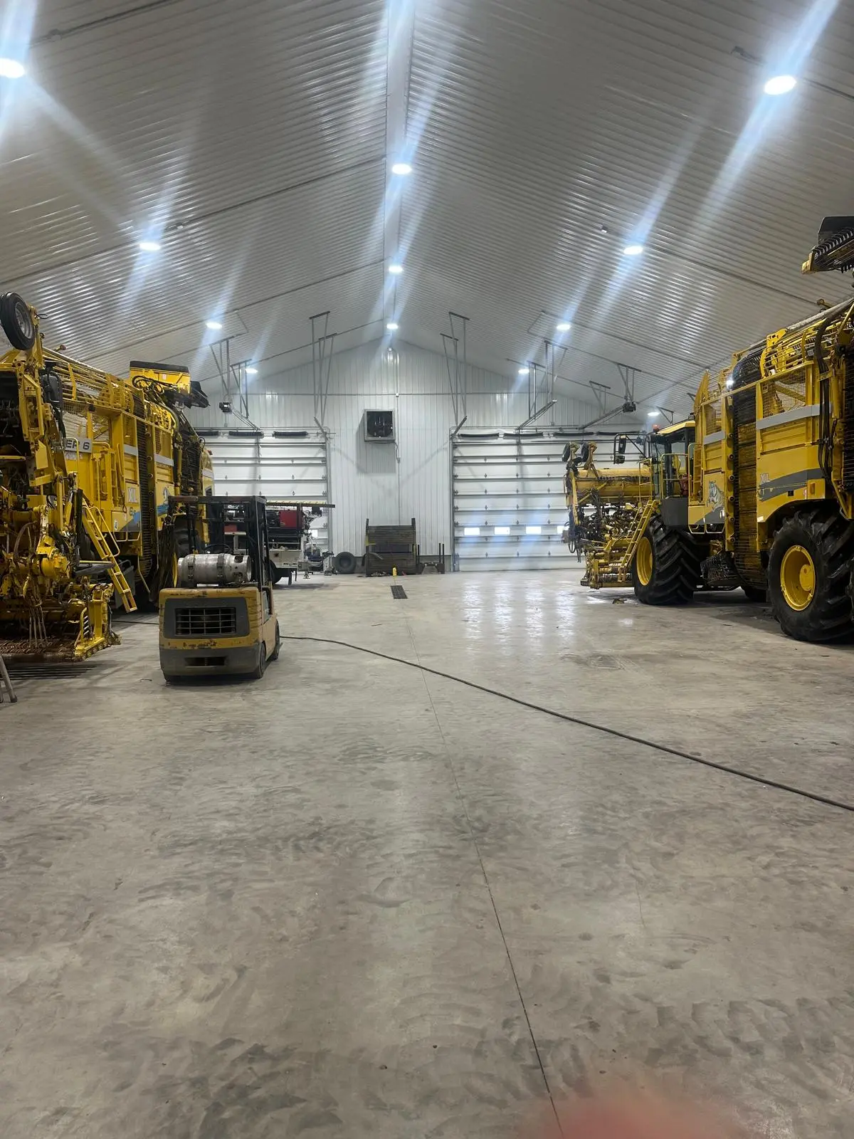 Interior of the shop at ROPA North America with two Tigers and a small forklift.