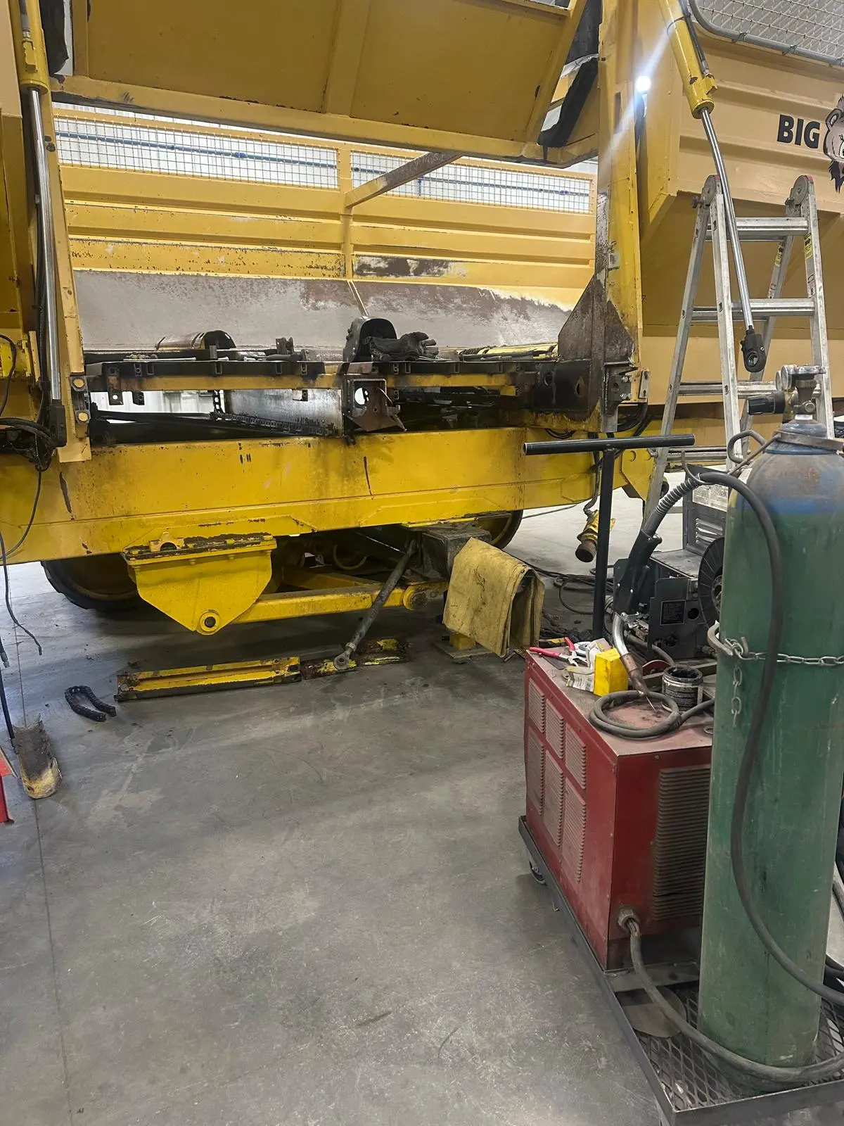 Repairs being completed on a Big Bear sugar beet cart