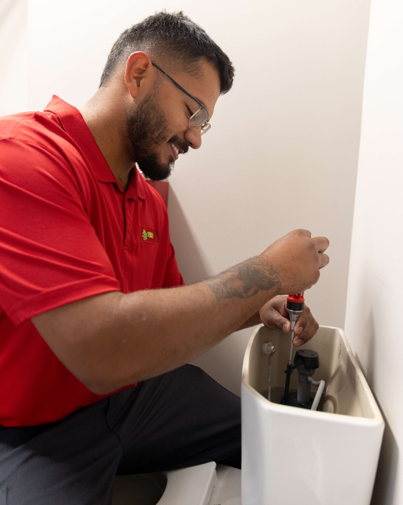 Clogged toilet plumber Indiana, drain cleaning, plumbing repair, bathroom plumbing services, emergency plumbing Indiana, Cornwell Plumbing.|Clogged toilet being cleared with a toilet plunger, bathroom plumbing repair, Cornwell Plumbing services.