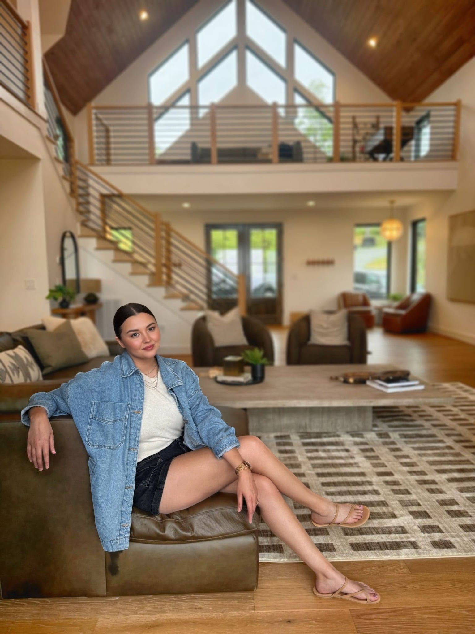 Rachel, the designer behind The Refinery, in a finished lodge living room