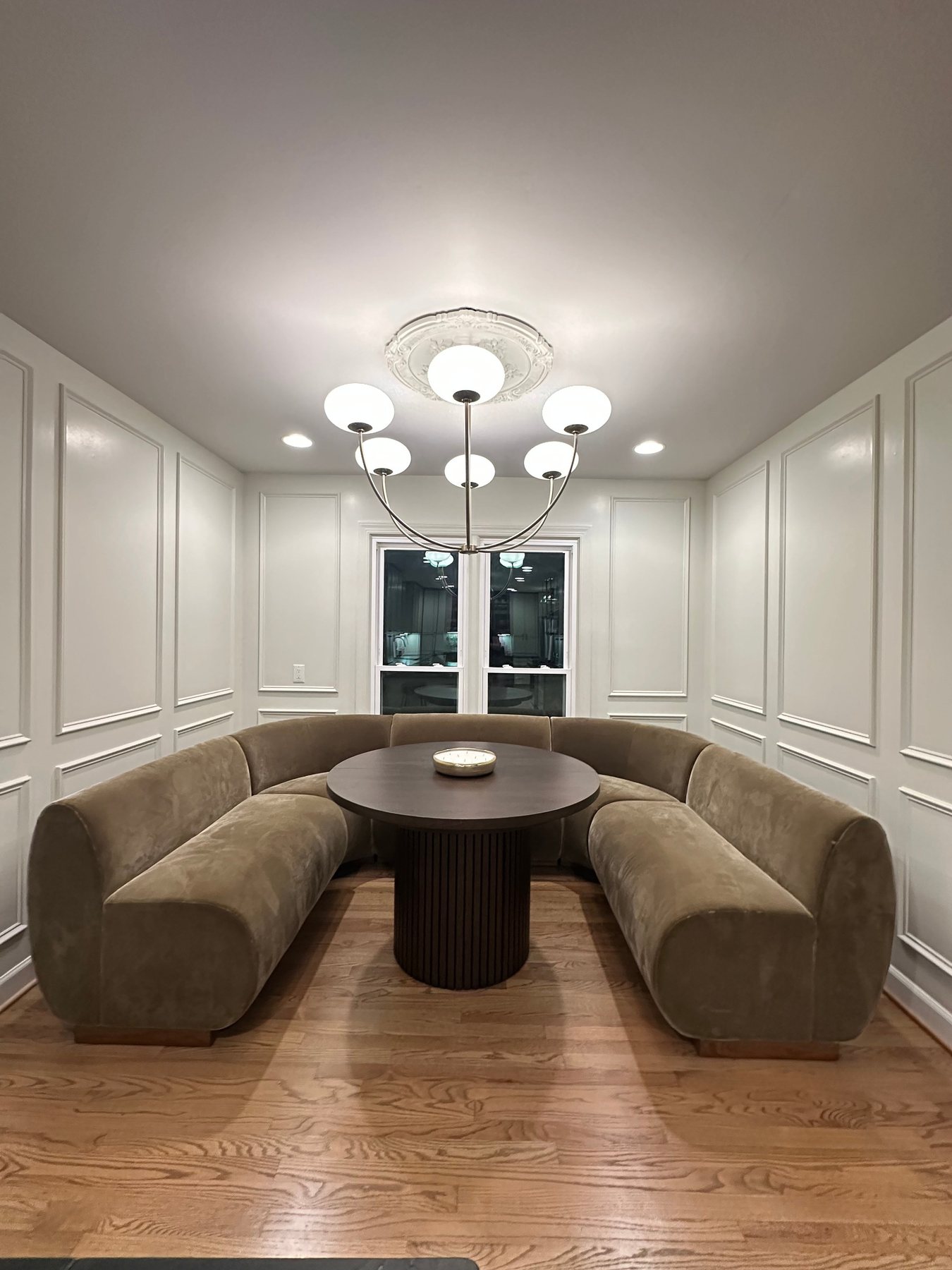 The Helm's House curved banquette dining room