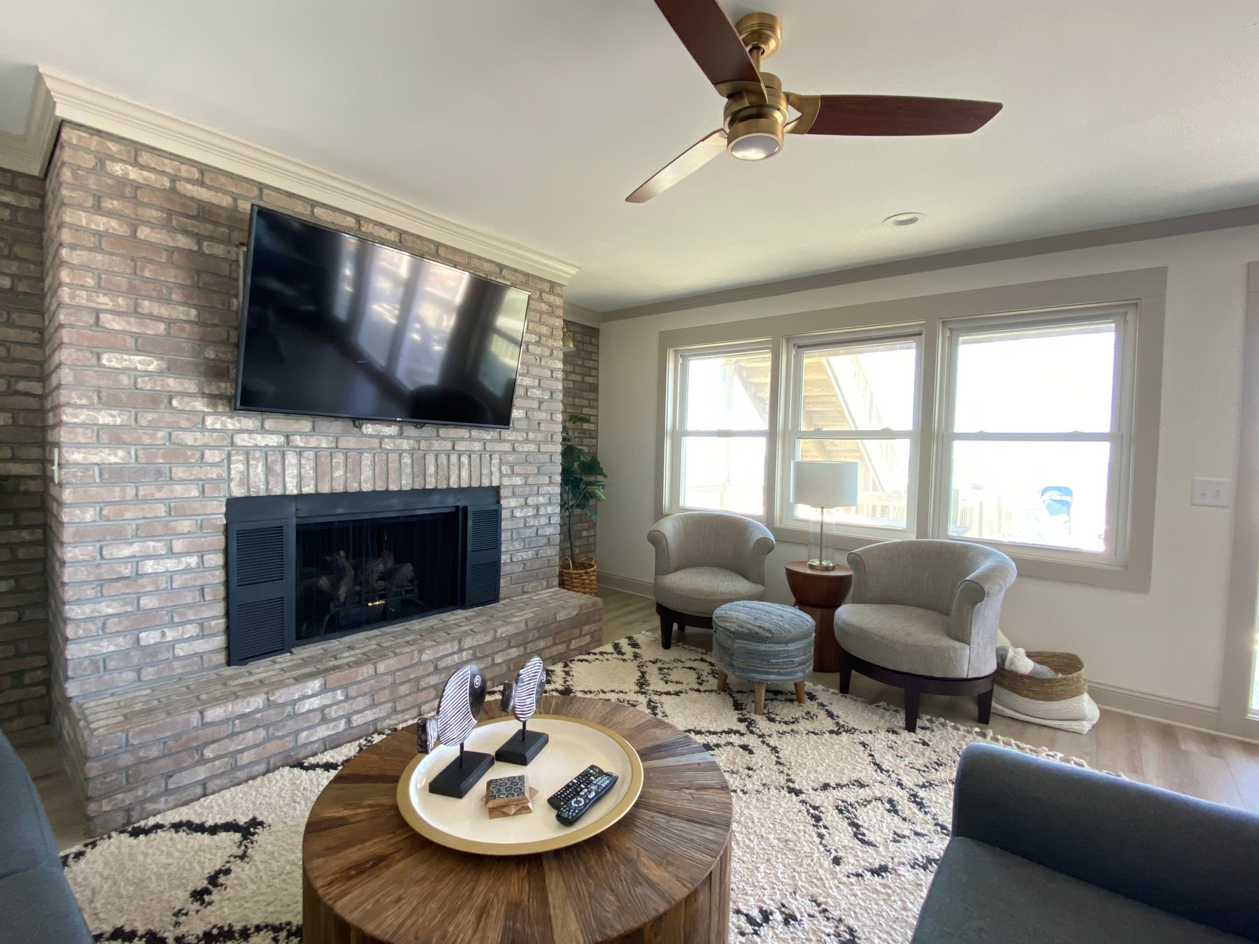 Holden Beach Bungalow living room with painted brick fireplace