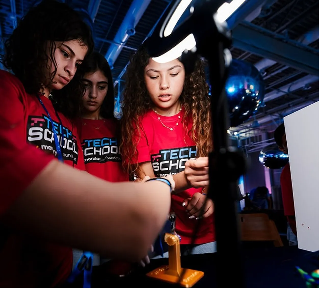 A picture of students looking at a three 3D printed object!