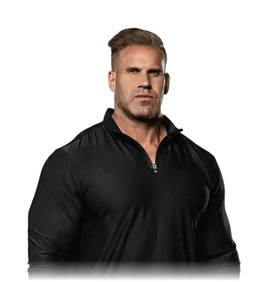 Muscular man with slicked-back blonde hair wearing a black zip-up workout shirt.