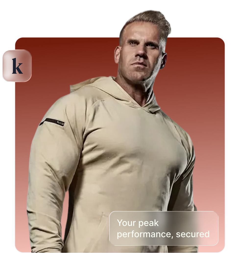 Muscular man in a beige hoodie posing confidently against a red gradient background with text 'Your peak performance, secured.'