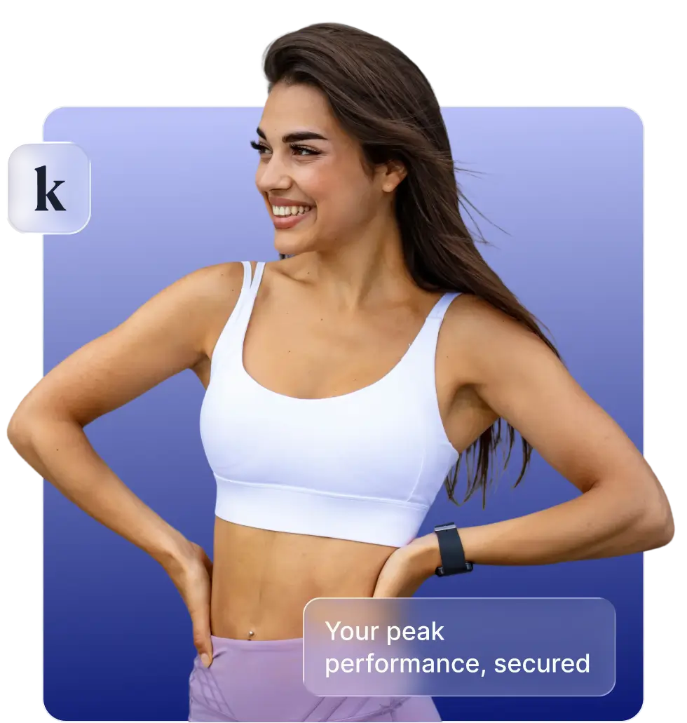 Smiling woman in white sports bra and purple leggings posing with hands on hips against a blue gradient background with text 'Your peak performance, secured.'