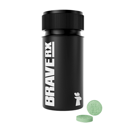 Black BraveRX medication bottle with two green tablets beside it.