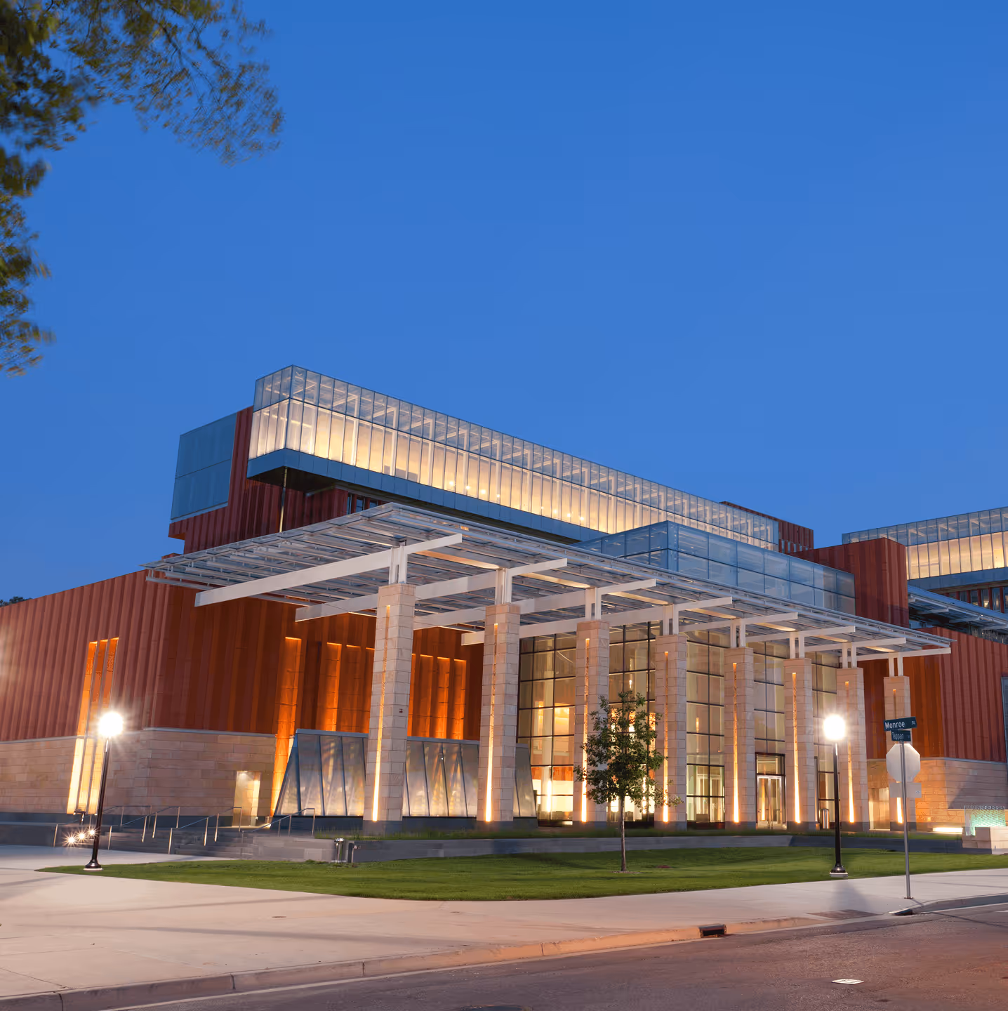 Office building with glass atrium entrance.