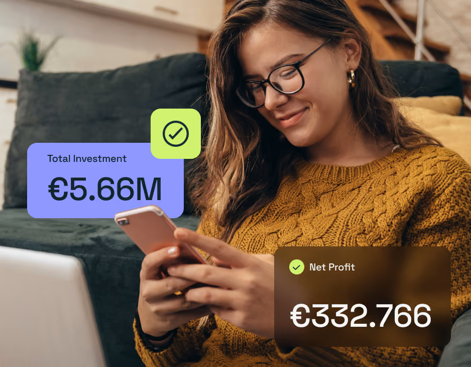 Woman in glasses and mustard sweater looks at phone with investment and profit data overlayed.