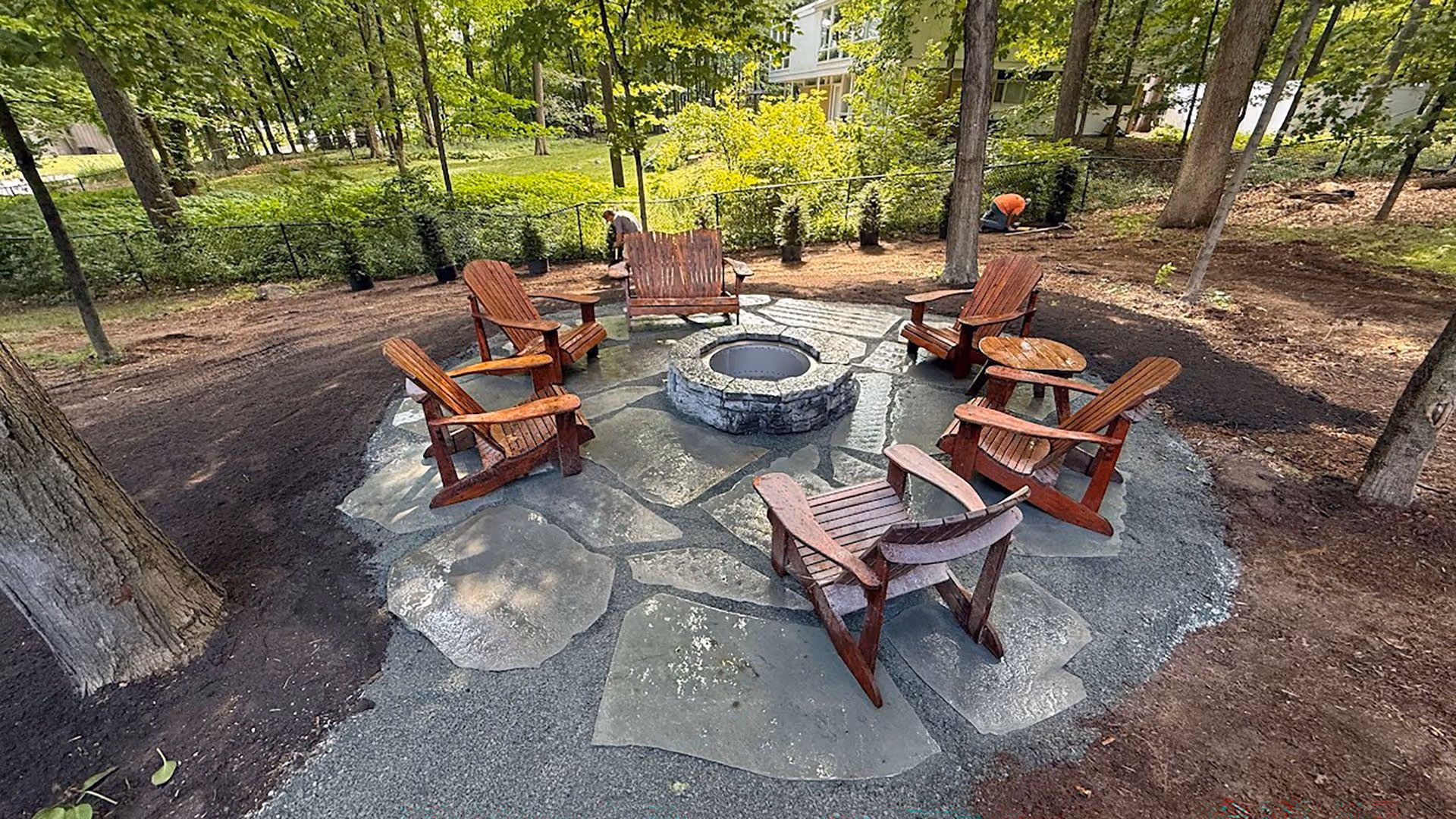 Outdoor living space with fire pit and seating"
