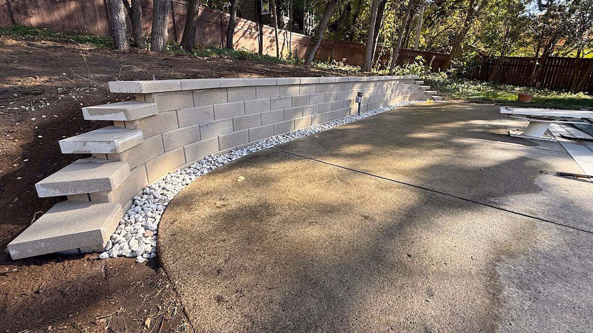 completed retaining wall project by sota landscaping