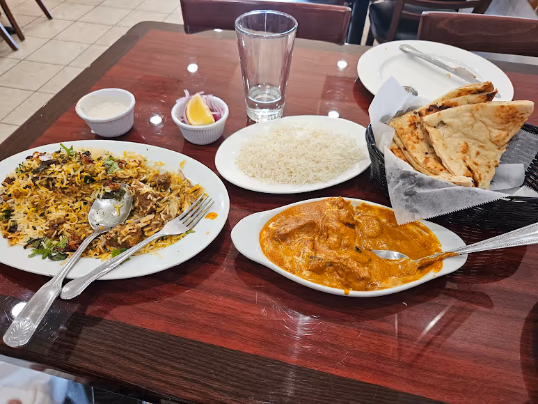 A table with a variety of foods on it.