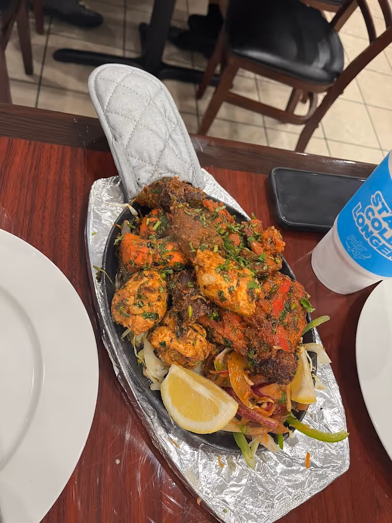 A silver tray with a variety of food items on it.