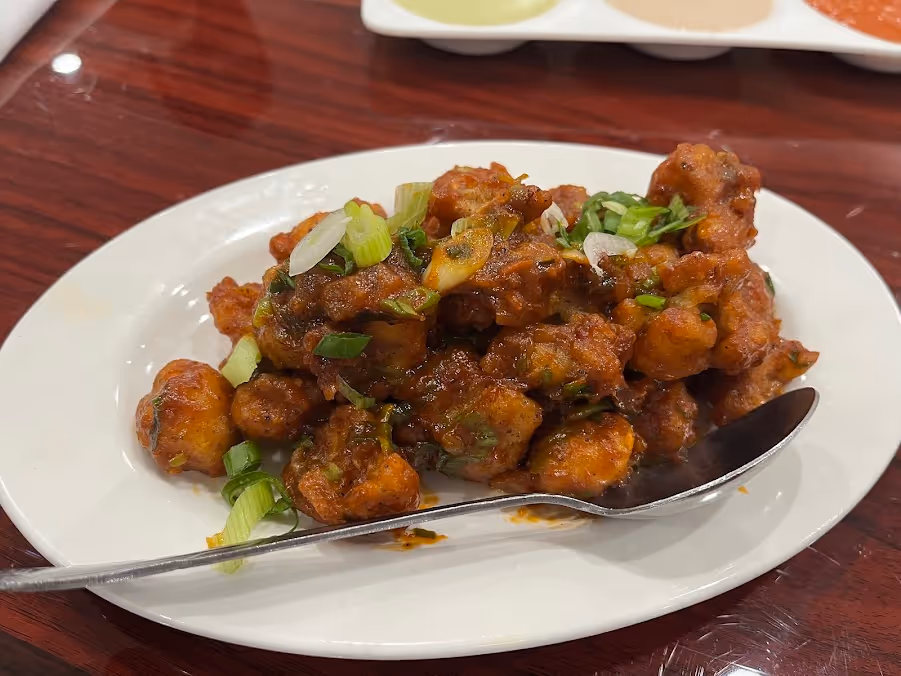 A plate of food with a fork on it.